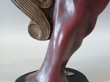 a close up of a sculpture of a horse on a stand
