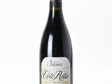 a bottle of wine that is sitting on a table