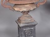 a large metal bowl sitting on top of a pedestal