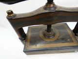 an old sewing machine that is on display on the table