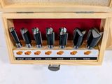 a picture of a set of drill bits in a wooden box