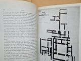 an open book with a picture of a plan in it