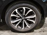 a close up of a car ' s wheel on the ground