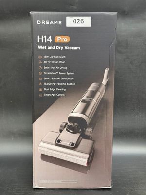 the box of a vacuum cleaner is sitting on the table