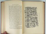 someone is holding a book open to a page with a drawing on it
