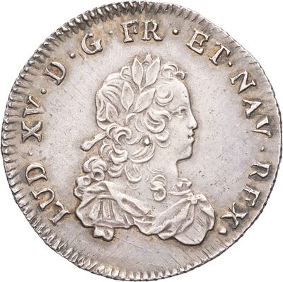 gros plan d'une pièce de monnaie sur laquelle figure une tête de femme