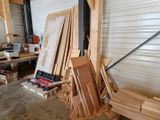 several pieces of wood are stacked on top of each other in a garage