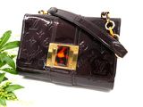 brown leather purse with tortoise shell and gold hardware