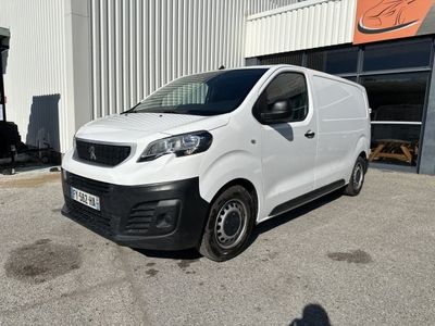a white van parked in front of a building