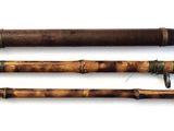 three different types of fishing rods are lined up on a white surface
