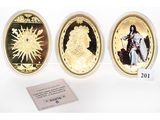three gold coins with a picture of a woman and a man on them