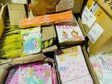 many boxes full of different types of paper on the floor