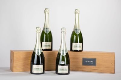 three bottles of champagne in a wooden box on a white background