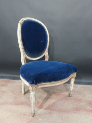 an image of a blue and white chair with a blue seat