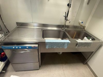 a stainless steel sink and a dishwasher in a kitchen