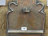 a metal chair that has a star of david on it