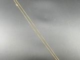 a gold plated necklace with a square shaped pendant on a chain