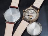 three watches that are sitting on a table together