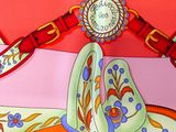 a colorful scarf with a picture of a tea cup on it