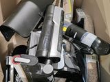 a cardboard box filled with assorted items including a blow dryer