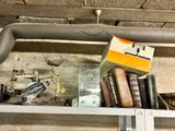 a shelf with books and a box on top of it