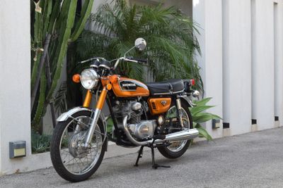 a motorcycle that is parked on the side of the street