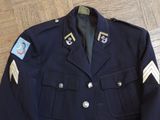 an image of a military jacket with patches on the sleeves