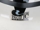 a sticker that says pacific new zealand on the back of a surfboard