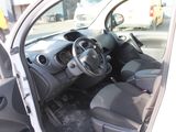 the interior of a small car with a steering wheel and dashboard