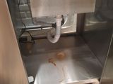 a dirty sink in the middle of a kitchen