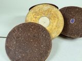 three different types of discs sitting on a white surface