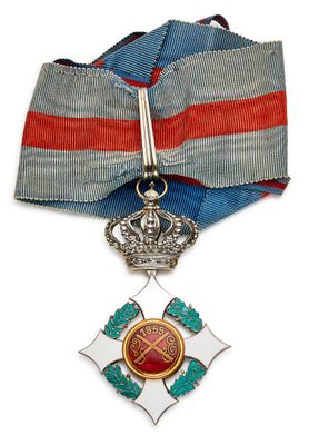 une image représentant une médaille ornée d'une croix et d'un ruban