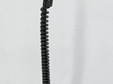 a black lamp that is on top of a table