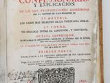 an open book with a picture of a coat of arms on it