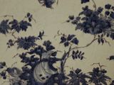 a picture of a blue and white plate with a bird on it