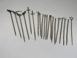 several different types of metal tools are arranged on a white surface