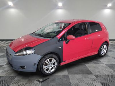 a picture of a red and grey car in a garage