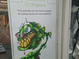 a sign with a picture of a plant on it