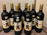 six bottles of wine are lined up on a counter top