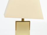 brass plated table lamp with a square shade on a white background