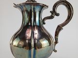 silver plated coffee pot with ornate handle and handle