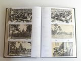 a book with pictures of a city and a train on it