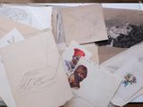 a lot of drawings and pictures on the table