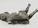 an image of a sculpture of a person laying on the ground