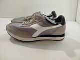 the shoes are grey and white with a white stripe on the side