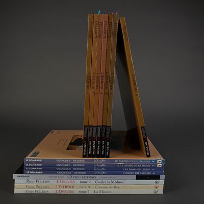 books stacked on top of each other on a gray surface