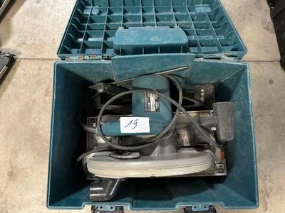 a blue box with some wires in it on the floor