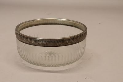 an image of a silver and glass bowl on a white surface