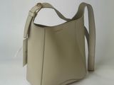 beige leather handbag on white background with white background