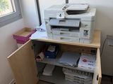 a printer that is sitting on top of a desk